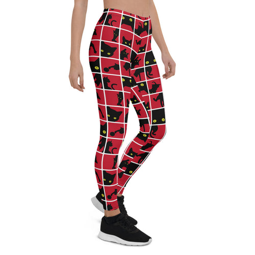 Silhouette de chat noir sur legging rouge